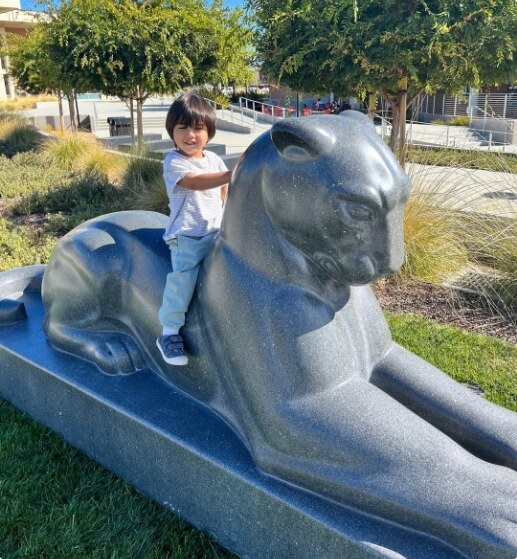 child on pather statue
