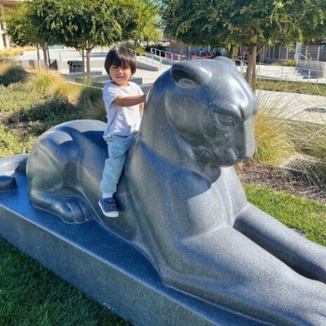 Child on panther statue